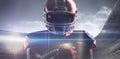 Composite image of american football player in helmet holding rugby ball Royalty Free Stock Photo