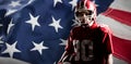 Composite image of american football player in helmet holding rugby ball Royalty Free Stock Photo