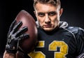 American football player holding ball Royalty Free Stock Photo