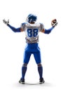 American Football player holding the ball in his hand. Joy in football. Sport emotions. Sport victory. Back view Royalty Free Stock Photo