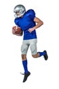 American football player holding ball in mid-air Royalty Free Stock Photo