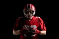 American football player holding rugby ball Royalty Free Stock Photo