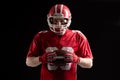 American football player holding rugby ball Royalty Free Stock Photo