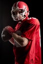 American football player holding rugby ball Royalty Free Stock Photo