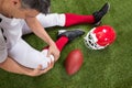 American football player with injury in leg Royalty Free Stock Photo