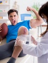 American football player with injury visiting doctor Royalty Free Stock Photo