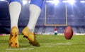 American football player kicking ball in close up Royalty Free Stock Photo