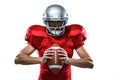 American football player in red jersey and helmet holding ball Royalty Free Stock Photo