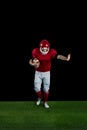 American football player wrestling through and protecting football Royalty Free Stock Photo