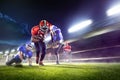 American football players in action on grand arena Royalty Free Stock Photo