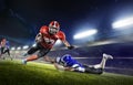 American football players in action on grand arena Royalty Free Stock Photo