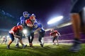 American football players in action on grand arena Royalty Free Stock Photo