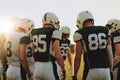 American football players standing in a huddle before a game Royalty Free Stock Photo