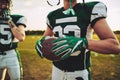 American football quarterback standing with a teammate during pr Royalty Free Stock Photo