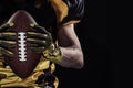 American football sportsman player on black background Royalty Free Stock Photo