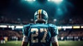 American football sportsman player on stadium with lights on background Royalty Free Stock Photo