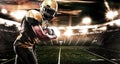 American football sportsman player on stadium running in action. Sport wallpaper with copyspace. Royalty Free Stock Photo