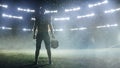 American Football Staduim: Lonely Athlete Warrior Standing on a Field Holds his Helmet and Ready to Royalty Free Stock Photo