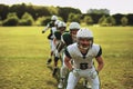 American football team doing drills on a sports field Royalty Free Stock Photo