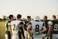 American football team standing in a huddle before practice Royalty Free Stock Photo