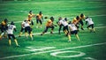 American Football Teams Start Game: Professional Players, Aggressive Face-off, Tackle, Pass, Fight Royalty Free Stock Photo