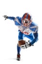 American football. Young agile american football player running fast towards goal line. Sports emotions. Sportsman in Royalty Free Stock Photo