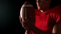 American footblall player holding ball