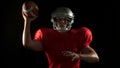 American footblall player with red jersey playing