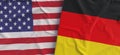 American and German flags. Linen flag close-up. Flag made of canvas. United States of America. German. State national symbols. 3d Royalty Free Stock Photo