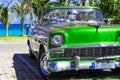 American green 1956 convertible vintage car on the beach in Varadero Cuba - Serie Cuba Reportage