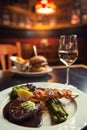 American hamburger with glass of beer or wine in restaurant, beer, hamburger, wine and other american specialites