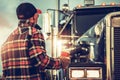 Semi Truck Driver Getting Ready For His Job Finishing His Cup of Coffee