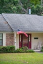 American home with flag and red door Royalty Free Stock Photo