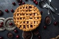 American homemade cherry pie on the table and muffins