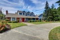 American house exterior with blue and white trim. Also red front door Royalty Free Stock Photo