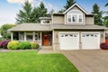 American house exterior with double garage and well kept lawn. Royalty Free Stock Photo