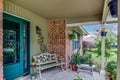 American House Front Porch Decorated with Plants and Bench, Stone and Wood Construction Architectural Feature