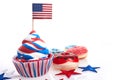 American independence day, celebration and holidays concept - glazed donut, candies, cupcakes in disposable tableware Royalty Free Stock Photo