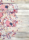 American independence Day, celebration, patriotism and holidays concept - flags and stars on the 4th of July party on top on woode Royalty Free Stock Photo
