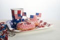 American independence day, celebration, patriotism and holidays concept. Sweet donut with candies in disposable Royalty Free Stock Photo