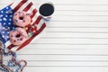 American independence day, celebration, patriotism and holidays concept. Sweet donut with candies in disposable Royalty Free Stock Photo