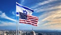 Israeli and American flags flying in the blue sky without people Royalty Free Stock Photo