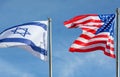 American and Israeli flags waving in the wind together in the sky