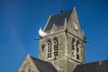 American John Steele paratrooper memorial hanging at the church rooftop ot Sainte-MÃÂ¨re l`Eglise, Normandy Royalty Free Stock Photo