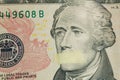 American leader Alexander Hamilton with mouth glued on the banknote of ten dollars USA