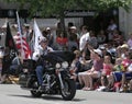 American Legion Riders Member riding his Motorcycle with flags at Indy 500 Parade