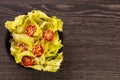 American lettuce salad with cherry tomatoes sprinkled with white sesame