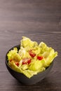 American lettuce salad with cherry tomatoes sprinkled with white sesame