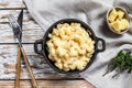 American mac and cheese, macaroni pasta in cheesy sauce. White wooden background. Top view Royalty Free Stock Photo