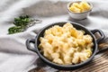 American mac and cheese, macaroni pasta in cheesy sauce. White wooden background. Top view Royalty Free Stock Photo